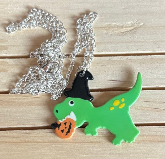 Dinosaur with a pumpkin necklace