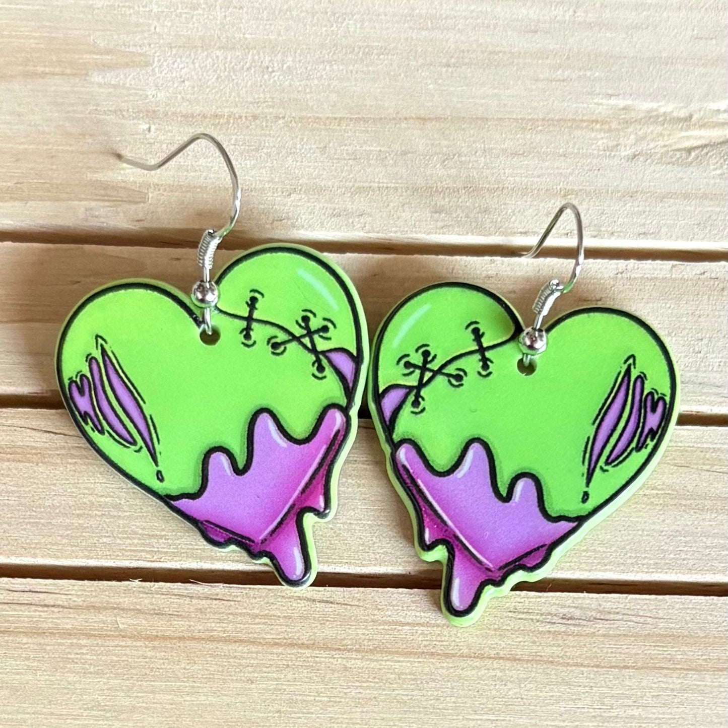 Green zombie heart earrings